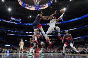 The cover for this NBA player props today article shows Giannis Antetokounmpo #34 of the Milwaukee Bucks going up for a shot against Marvin Bagley III #35 of the Washington Wizards.