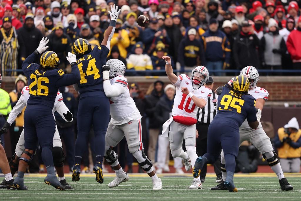The cover for this College football player props week 15 article shows Julian Sayin #10 of the Ohio State Buckeyes playing against the Michigan Wolverines.