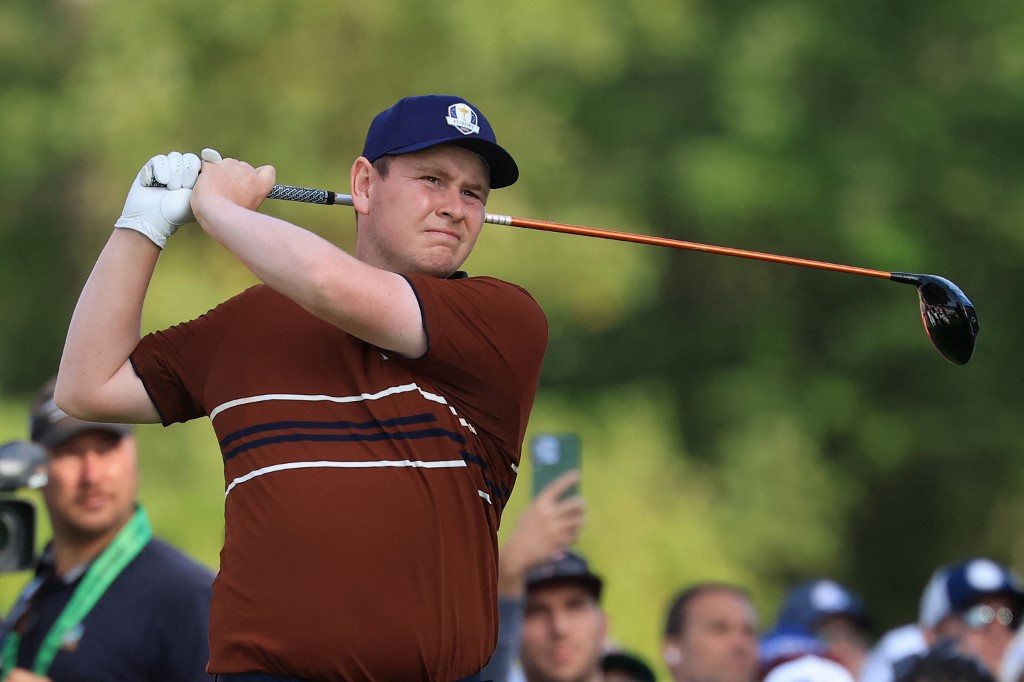 Robert MacIntyre of Europe tees off on the 6th hole during the Saturday morning foursomes matches of the 2025 Ryder Cup.