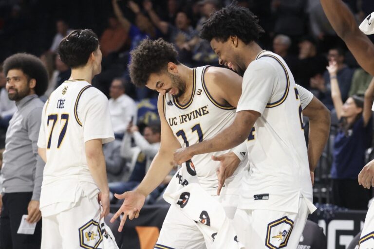 Devin Tillis #11 and Jurian Dixon #24 of the UC Irvine Anteaters celebrate in the closing seconds of the semifinal game of the Big West men's basketball tournament against the Cal Poly Mustangs.
