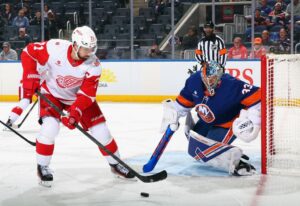 The cover for this NHL anytime goals scorer article shows David Rittich #33 of the New York Islanders defends against Dylan Larkin #71 of the Detroit Red Wings.