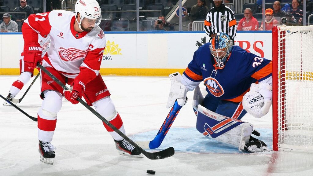David-Rittich-33-of-the-New-York-Islanders-defends-against-Dylan-Larkin-71-of-the-Detroit-Red-Wings-aspect-ratio-16-9