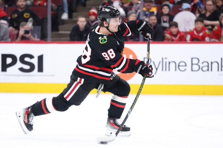 The cover for this NHL picks today article shows Connor Bedard #98 of the Chicago Blackhawks taking a shot on goal against the Anaheim Ducks.