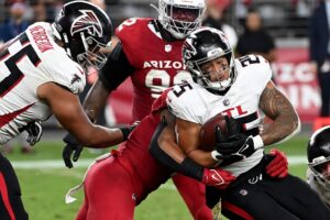 Tyler Allgeier #25 of the Atlanta Falcons runs the ball against the Arizona Cardinals.