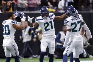 Devon Witherspoon #21 of the Seattle Seahawks reacts after a fourth quarter interception during the fourth quarter against the Atlanta Falcons.