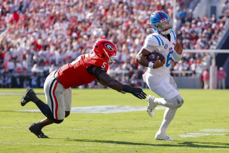 Trinidad Chambliss #6 of the Mississippi Rebels rushes in for a touchdown during the first quarter against the Georgia Bulldogs.