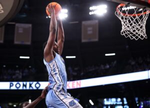 Caleb Wilson #8 of the North Carolina Tar Heels dunks against the Georgia Tech Yellow Jackets.