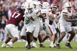 Mark Fletcher Jr. #4 of the Miami Hurricanes runs the ball against the Texas A&M Aggies.