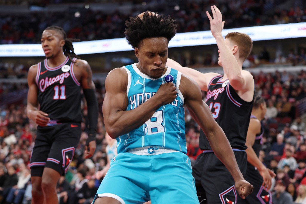 Collin Sexton #8 of the Charlotte Hornets celebrates scoring against the Chicago Bulls.