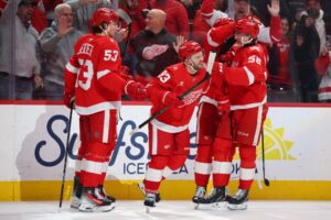 Alex DeBrincat #93 of the Detroit Red Wings celebrates his overtime goal to beat the Ottawa Senators.