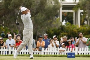 Si Woo Kim of South Korea plays his shot from the first tee during the final round of the Sony Open in Hawaii 2026.
