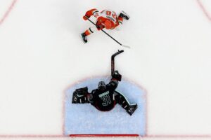 The cover for this NHL picks today article shows Philipp Grubauer #31 of the Seattle Kraken making a save on Jansen Harkins #24 of the Anaheim Ducks on a penalty shot.