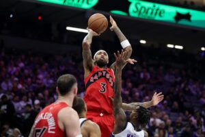 The cover for this NBA player props today article shows Brandon Ingram #3 of the Toronto Raptors shooting over Malik Monk #0 of the Sacramento Kings.