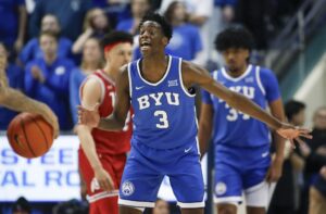 AJ Dybantsa #3 of the Brigham Young Cougars calls out a defensive play during the second half of their game against the Utah Utes.