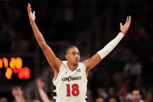 Baba Miller #18 of the Cincinnati Bearcats celebrates after making a shot in the second half against the Iowa State Cyclones.