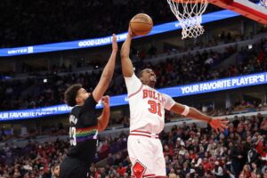 Jaden Ivey #31 of the Chicago Bulls attempts a dunk against Cameron Johnson #23 of the Denver Nuggets.