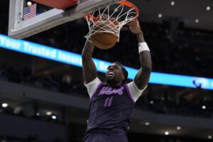 Naz Reid #11 of the Minnesota Timberwolves dunks the ball against the Milwaukee Bucks.